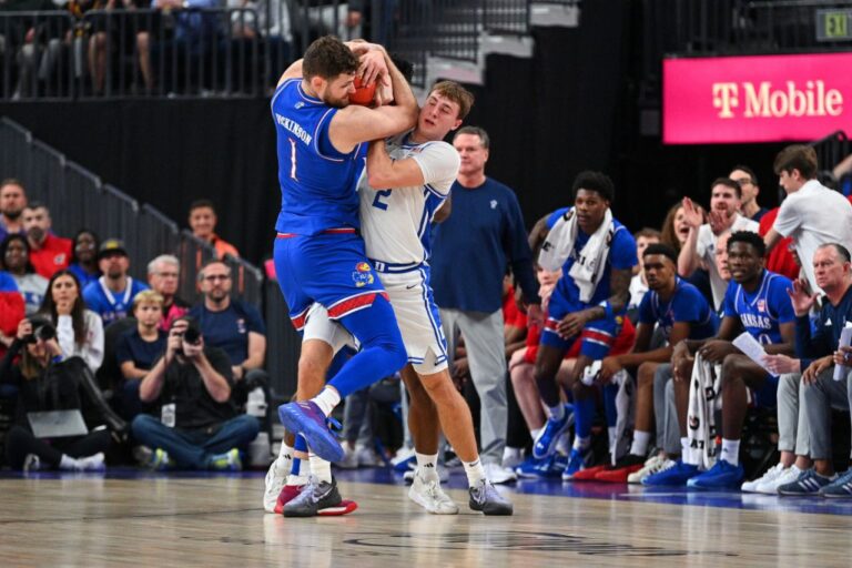 Shocking Ejection: Kansas' Dickinson Kicks Duke's Brown in the Face!